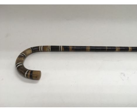 A horn and bone banded walking stick.