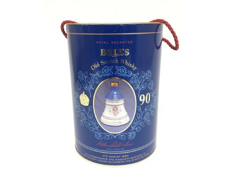 A boxed Bells Old Scotch Whisky in commemorative bell shaped bottle for the ninetieth birthday of the Queen Mother.