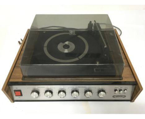 A Stereogram 2000 De Luxe record player, attributable to Readers Digest with speaker settings knobs for bass and treble to ma