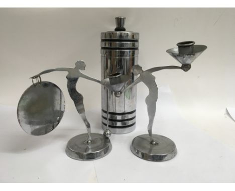 A Art Deco chrome candle stick together with a dinner gong in the of maidens and a cocktail shaker