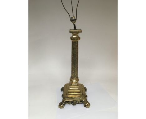 A brass table lamp with Oriental style decoration, approx 80cm.