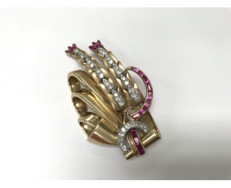 An Art Deco 18ct gold diamond and ruby starburst brooch. Weight approx 24g