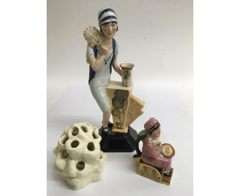 A limited edition Kevin Francis Clarice Cliff figure number 203/250, a mini promotional example and a ceramic flower arranger