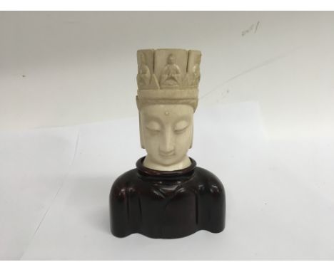 A ivory Buddha head  on carved base  15 cm and a small ivory netsuke