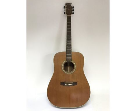 A Cort acoustic guitar.