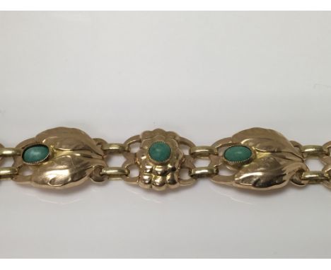 A early 20 th century George Jensen 18 k gold bracelet of stylistic design inset with Amazonite  19 cm