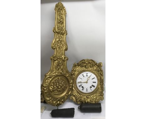 A similar lot, a French farmhouse wall clock having Roman numeral enamel dial in gilt surround, with weights, pendulum and ke
