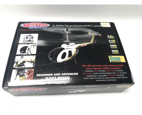 An indoor, scale, micro helicopter in very good condition with spare parts and original box. 2.4ghz transmission and 4-ch con