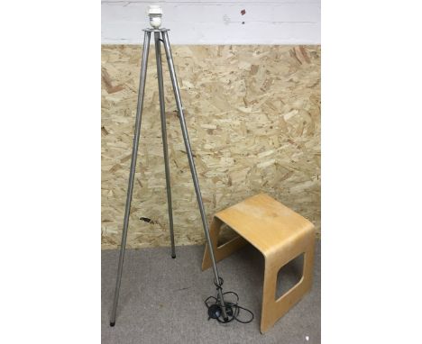 A floorstanding, folding metal tripod stand and a plywood occasional table