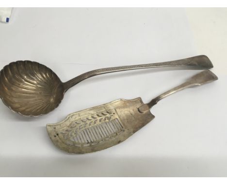 A large decorative silver ladle London 1832. and a silver fish slice London 1817.