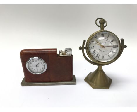 A pair of table clocks; one a glass ball clock and the other a table lighter. Neither seen working.