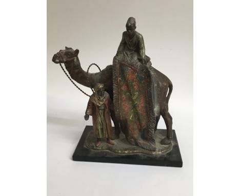 A Art Deco style table lighter figures by a camel