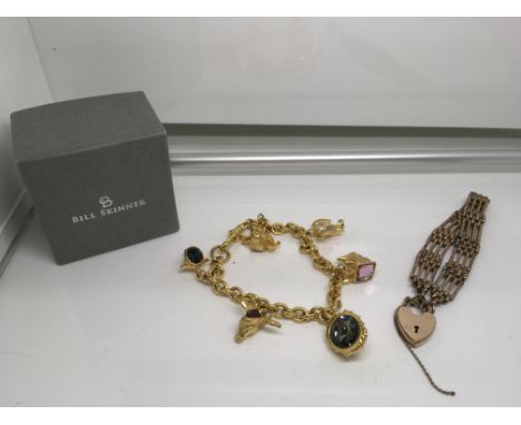 An 18ct rolled gold gate bracelet and Bill Skinner animal charm bracelet