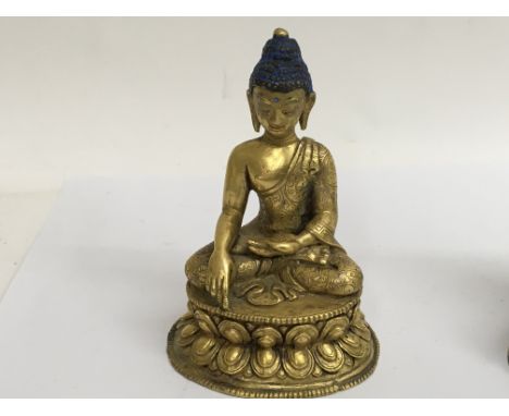 A gilt 18 th century well detailed bronze Buddha 10 cm