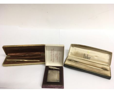 A boxed Charles lighter and boxed Parker and Sheaffer pens