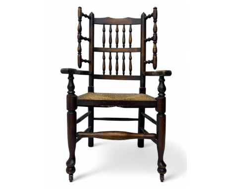 Early 19th century ash armchair, the back with winged spindles extending from a shaped top rail, above a splat of two rows of