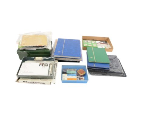 Collection of philatelic paraphernalia, including empty stamp albums, folders, stock cards, mounts, hinges, tweezers, postcar