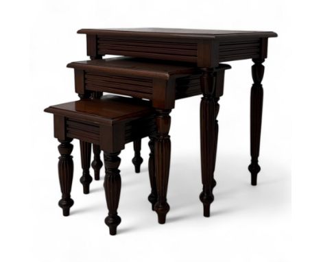 Early 20th century mahogany nest of three tables and curtain pole 11", each with rectangular top above a fluted frieze, on tu