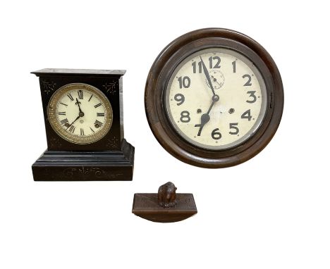 An American 19th century 8-day striking mantle clock and American early 20th century 8-day striking wall clock with a 20th ce