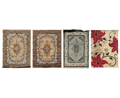 Four rugs of various styles; one 20th century oriental design rug, sage green field with geometric medallion and ivory ground