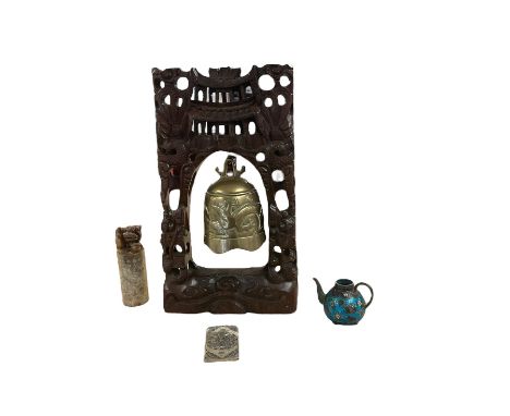 Carved soapstone seal, with character marks to the sides and temple dog finial, together with brass bell on a wooden stand an