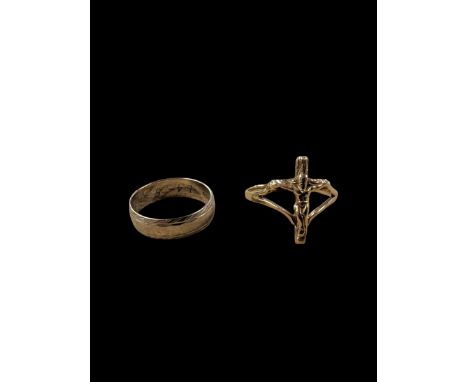 Two 9ct gold rings, including crucifix design ring and white gold engraved wedding band, both hallmarked Condition Report:App