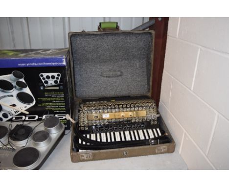 A Hohner piano accordion in carrying case