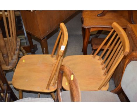 A pair of stick back kitchen chairs 