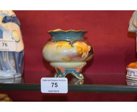 A small Royal Worcester vase painted with daffodils 