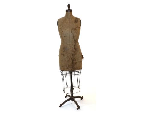 Circa 1940s J F Bauman, New York Adjustable Mannequin with Wire Cage Skirt, with a brown card torso, tin arm inserts and neck