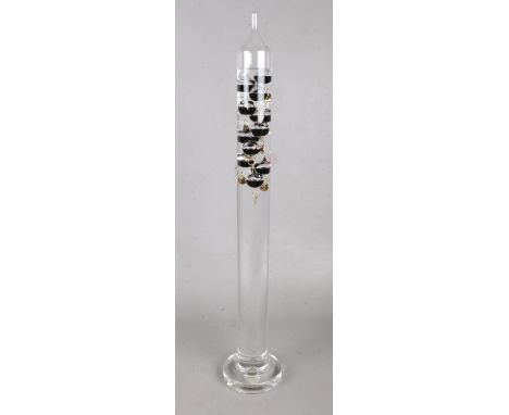 A German Galileo liquid glass thermometer. 63cm tall.  