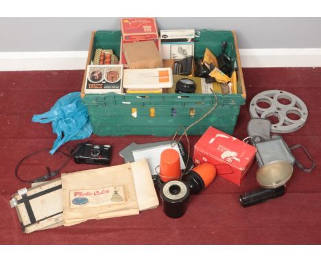 A box of projector and camera equipment. Including cameras, film reels, viewers, etc.  