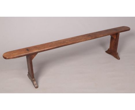 A 19th Century ash and elm long bench with exposed tenon joints, 200cm  