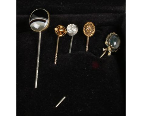 Two Victorian 15ct gold stick pins and three other antique examples.  