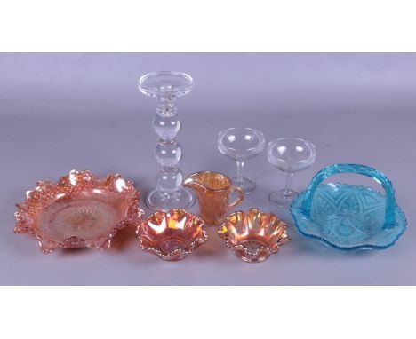 A collection of glassware. To include two Babycham glasses, four pieces of carnival glass and a large glass candlestick etc. 