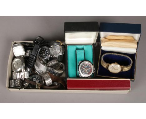 A box of wristwatches. Including Accurist Chronograph, Ascot, Casio, etc.  