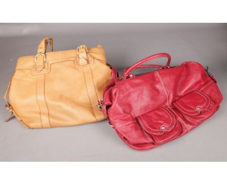 Two leather handbags in deep red and light tan.  