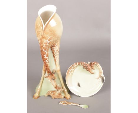 A Large Ceramic Vase in the form of a Giraffe Licking her Calf, together with a Small Side Plate and Spoon. Produced by Franz