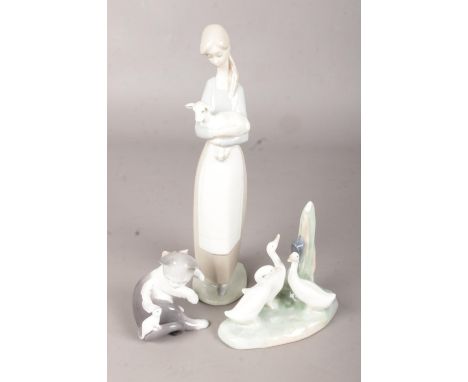 Two Lladro Figures, of a Woman holding a Lamb and a Cat and Mouse, together with a Nao (by Lladro) group of Geese.  