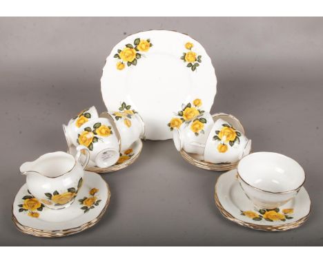 A Royal Vale Yellow Rose Part Tea Service. Includes Cups, Saucers and Side Plates  Restoration to one Saucer.