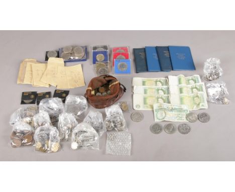 A large collection of pre decimal British &amp; World coins and notes. To include six one pound notes and a one pound Guernse