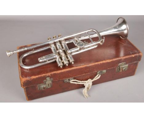 A cased Boosey &amp; Co LTD "Solbron" trumpet. With engraved floral decoration. Patent 193729. Includes Denis Wick and Boosey