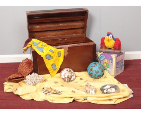 A collection of miscellaneous. Treasure chest, Talking Parrot (boxed), shells, inflatable horse etc  