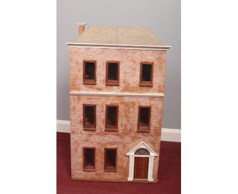 A vintage dolls house with a quantity of dolls furniture &amp; accessories. (82cm height 45cm width 23cm depth)  
