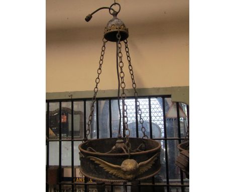 A run of four large iron work ceiling light fittings with gilt painted highlighted winged cherub detail, 40cm diameter, (recl