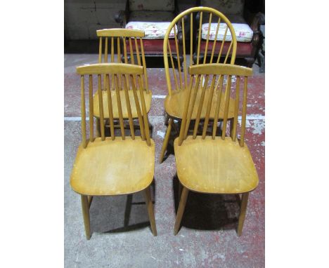 An Ercol stick back chair principally in elm and beechwood and three other stick back chairs 