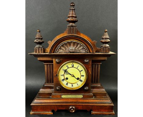 A large Edwardian mahogany architectural cased mantle clock with presentation plaque ‘To Mr A W Preston’, by the employees of