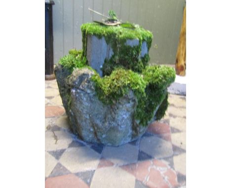 An antique architectural stone pinnacle section (possible inverted and later used as a garden ornament weathered and moss enc