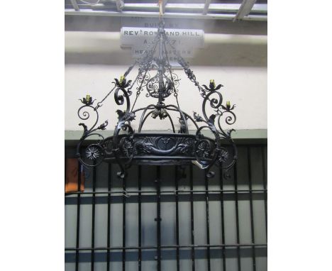 A good quality ironwork hanging ceiling light with decorative open scrollwork, flower head, leaf and stylised dolphin detail,