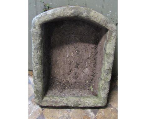 A weathered natural stone trough of rectangular form with D end, 62cm long x 46cm wide x 18cm deep 